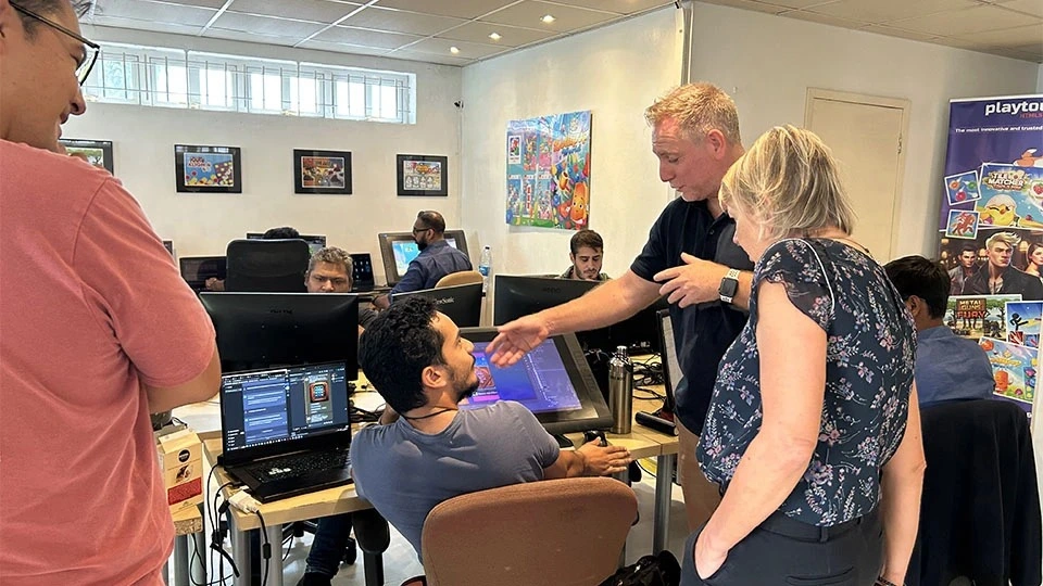 Playtouch game developers collaborating at the studio